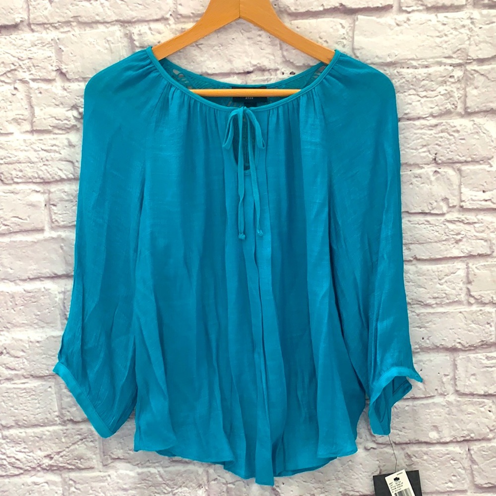 Ocean blue top with decorative back